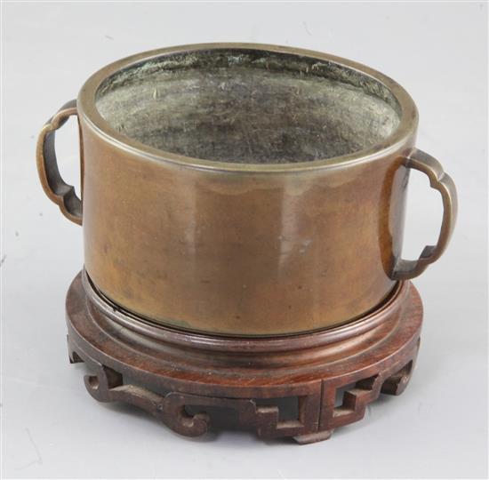 A rare Chinese Ming cylindrical bronze censer, 16th / 17th century, diameter 11cm, wood stand